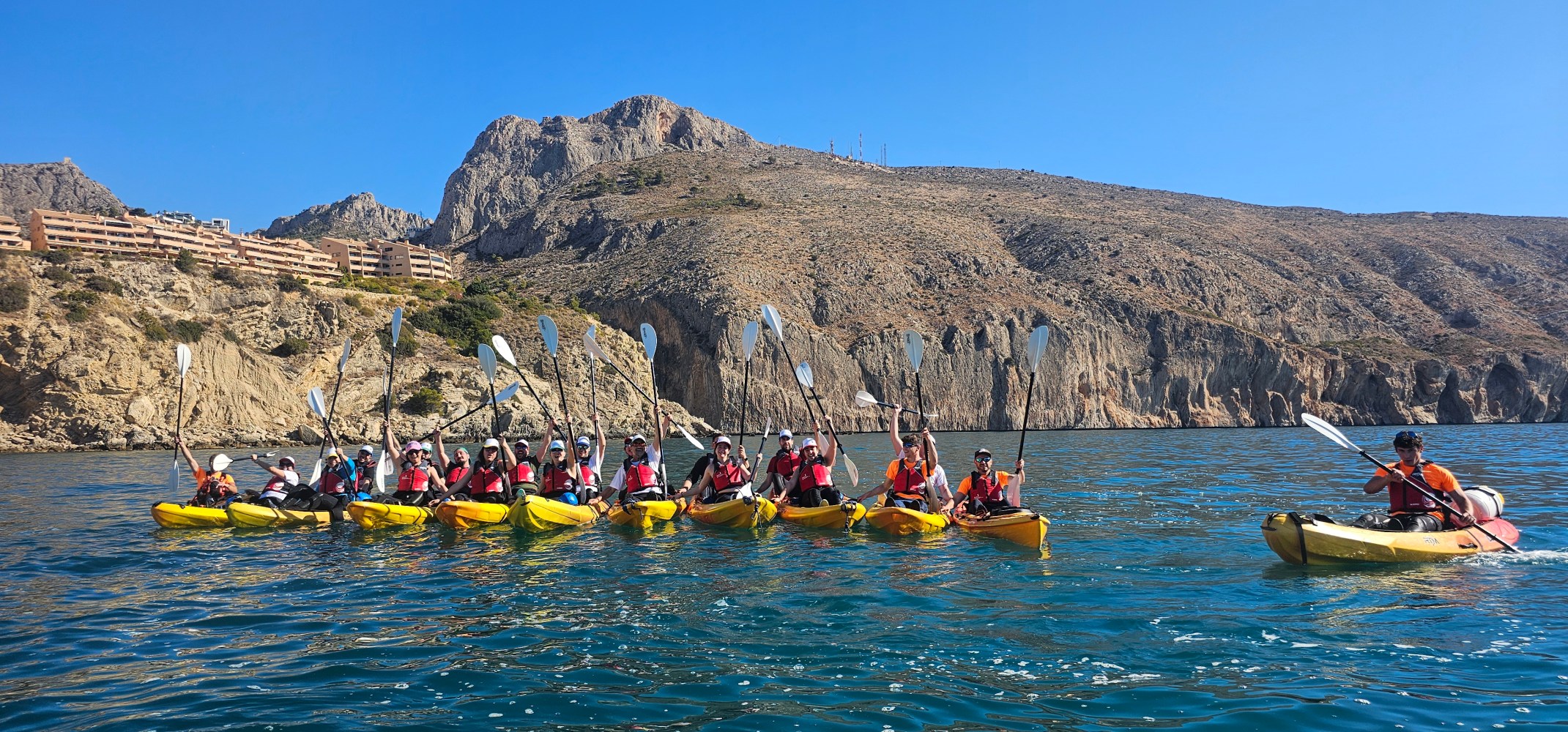 a group of people on a boat in the water