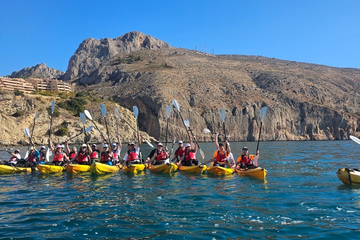a group of people on a boat in the water