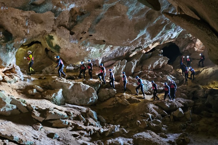 a group of people on a cave