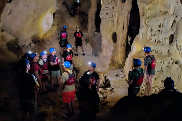 a group of people on a cave