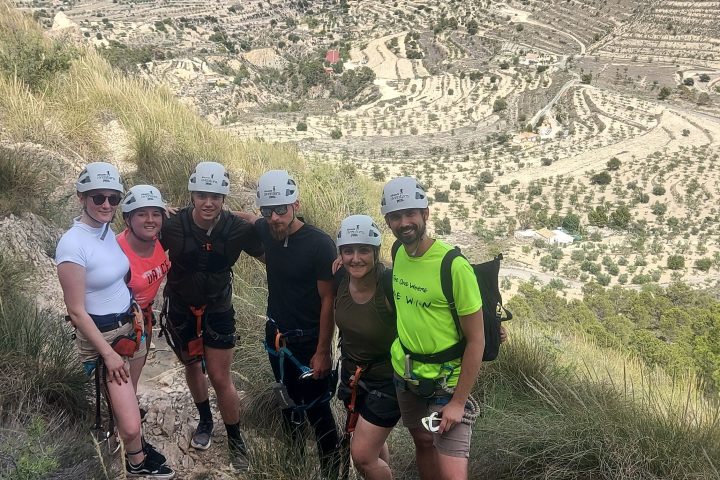 a group of people on a rocky hill