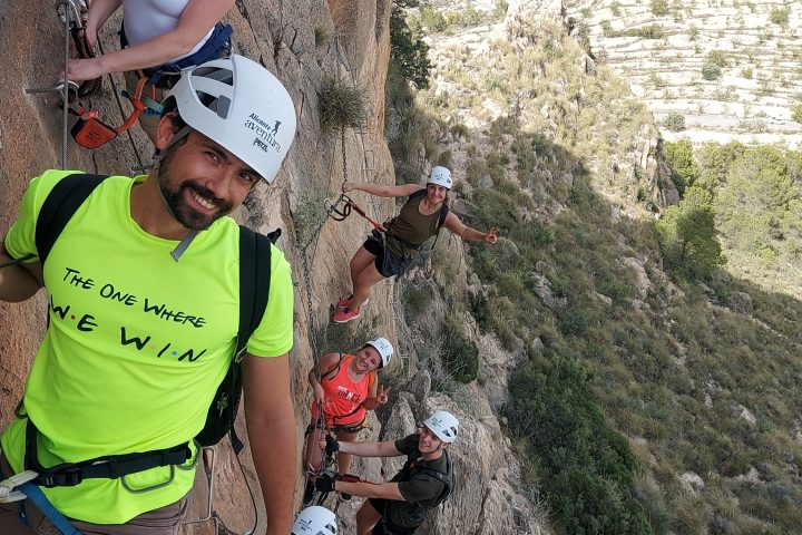 a man riding a bike down a dirt road
