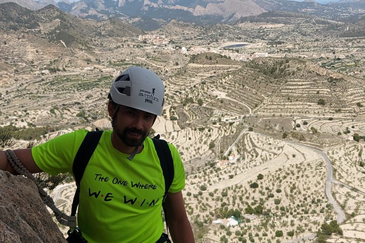 a boy with a mountain in the background