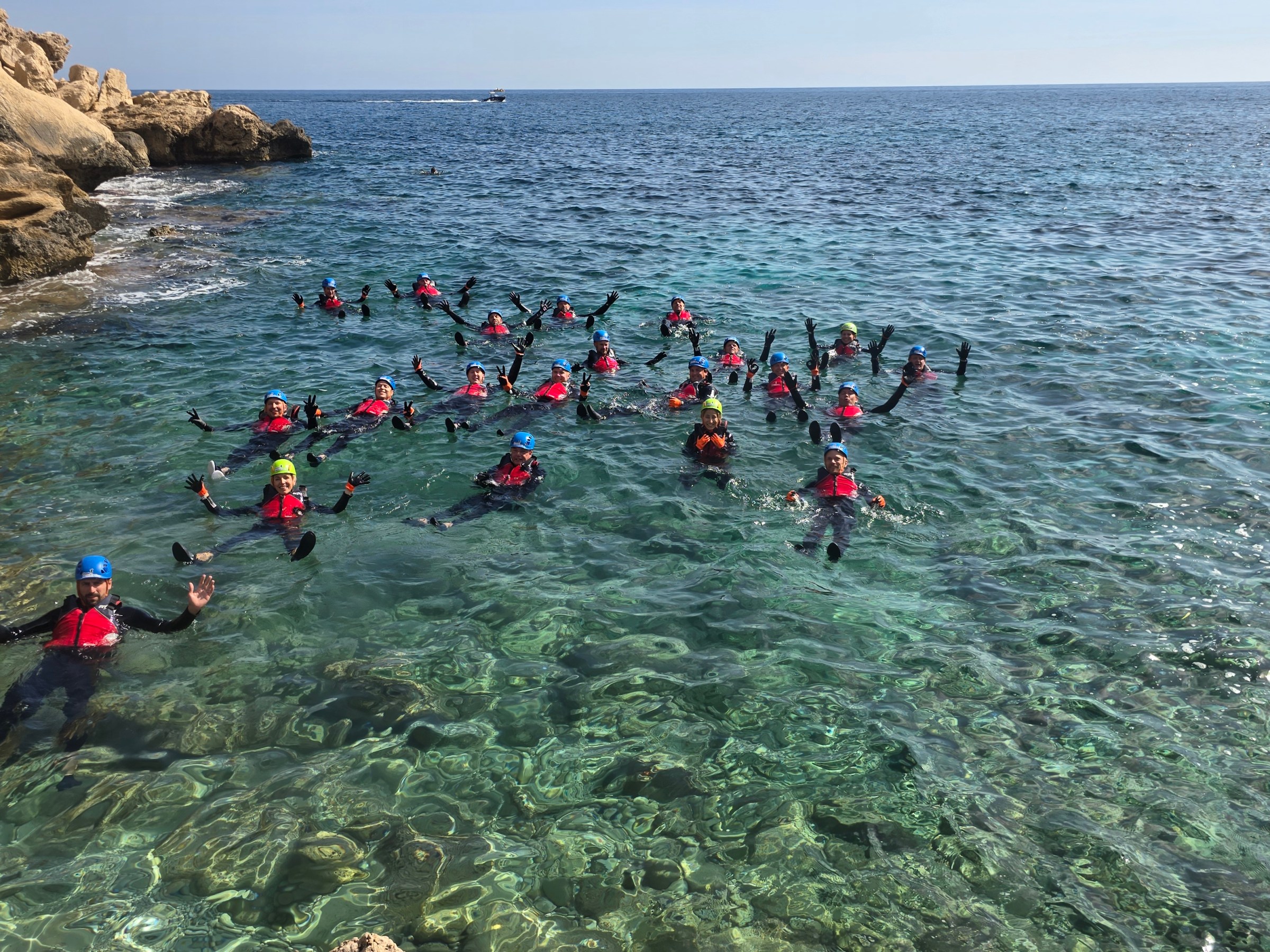 a group of people swimming in a body of water
