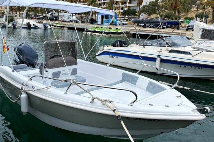 a boat is docked next to a body of water