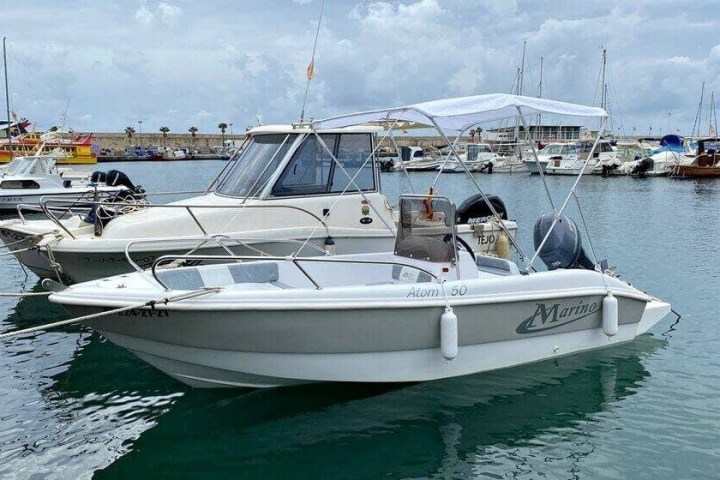a boat is docked next to a body of water