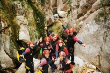 a group of people on a rock
