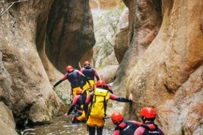 a group of people on a rock