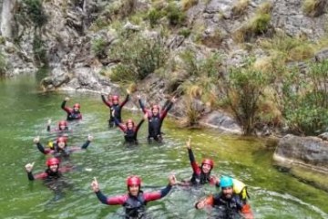 a group of people riding skis on a body of water