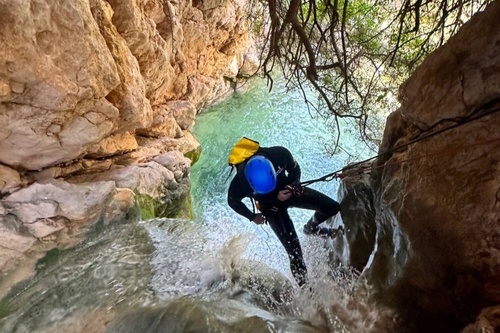 a person sitting on a rock