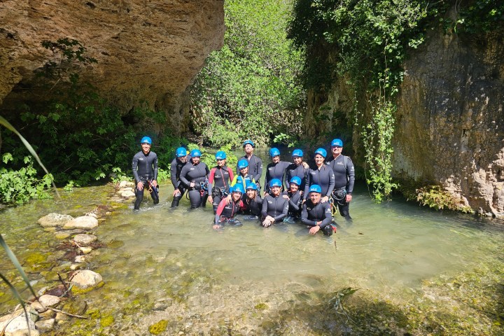 a group of people riding on the back of a motorcycle