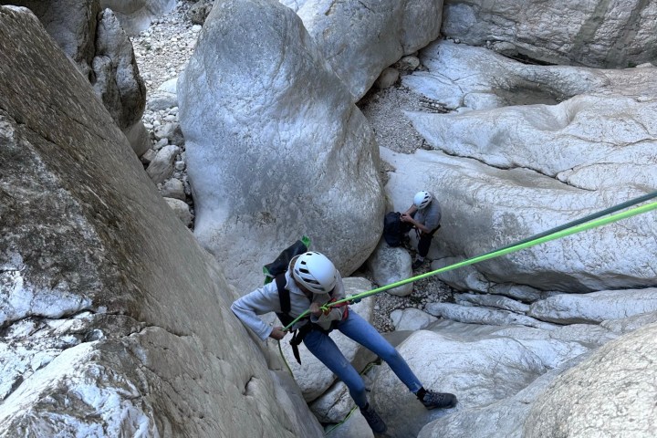 a person sitting on a rock