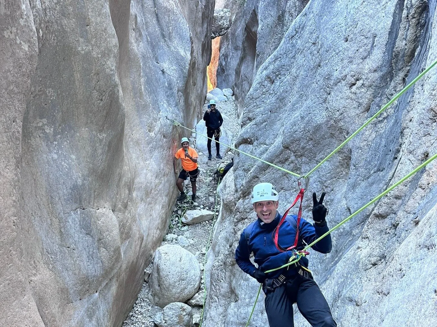 a person riding skis down a snow covered mountain