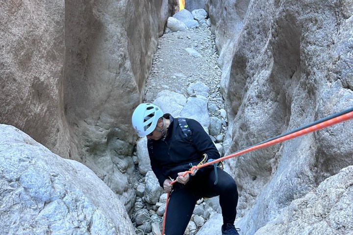 a man riding skis down a snow covered slope