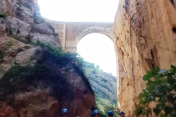 a person sitting on a rock