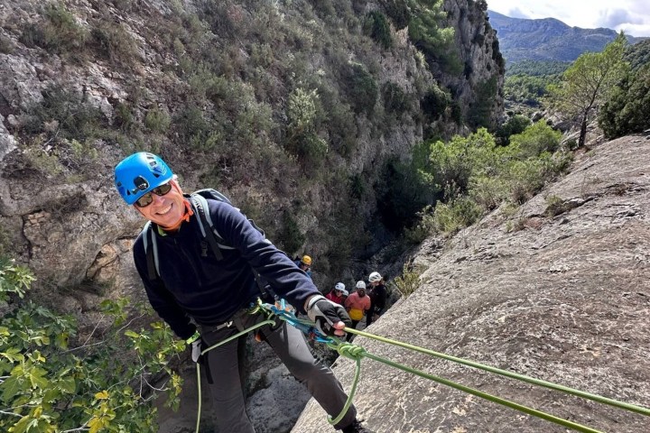 a man riding a bike down a dirt road