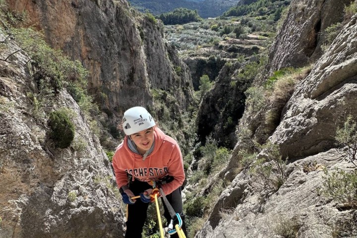 a man standing on a rocky hill
