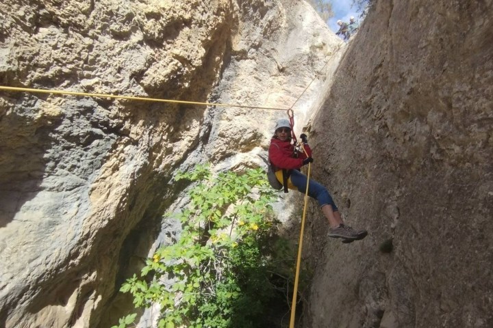 a man riding on top of a rock