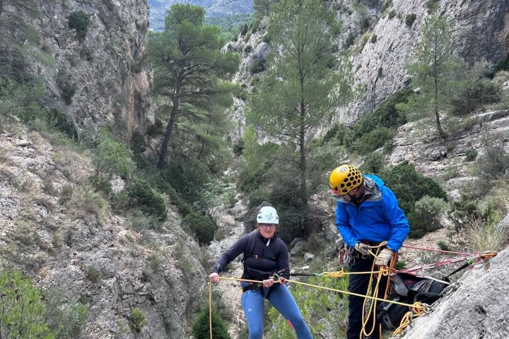 a man riding on top of a rocky mountain