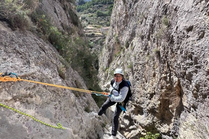 a man standing on a rocky hill