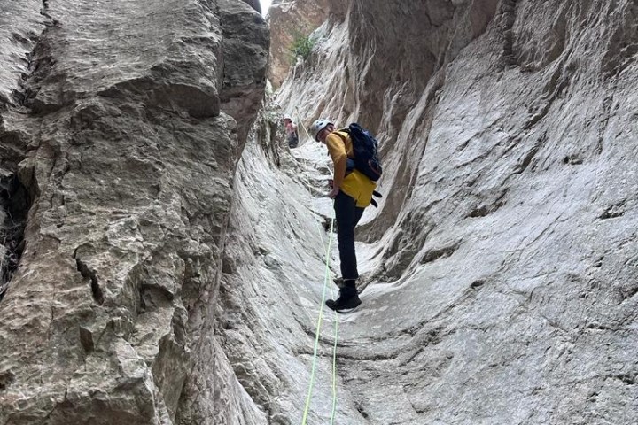 a man standing on a rocky hill