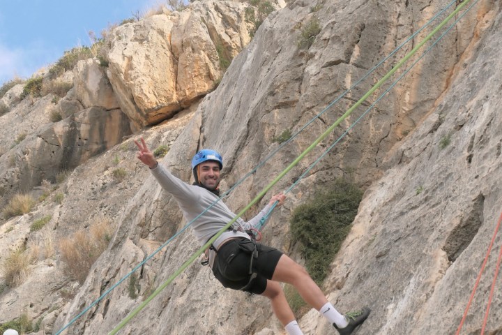 a man riding on top of a rocky mountain