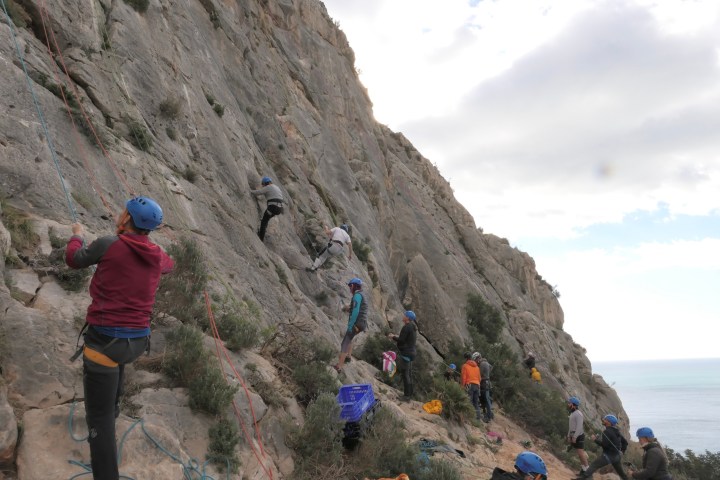a group of people on a rocky hill