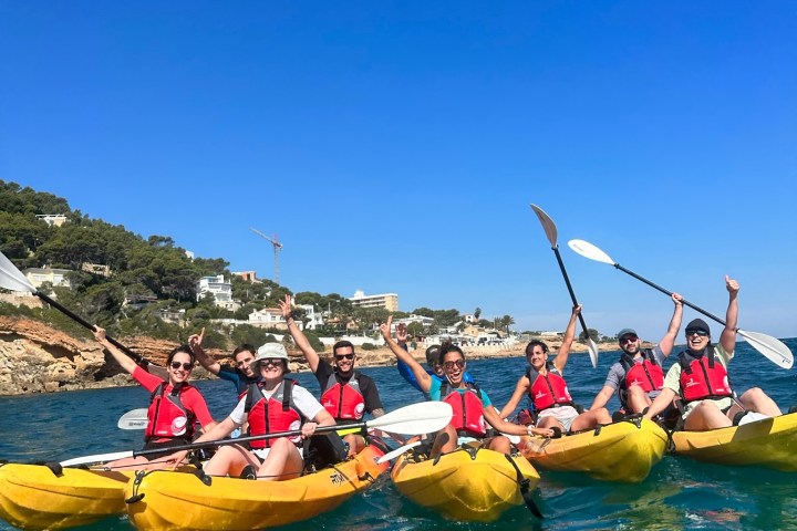 a group of people on a raft in a body of water