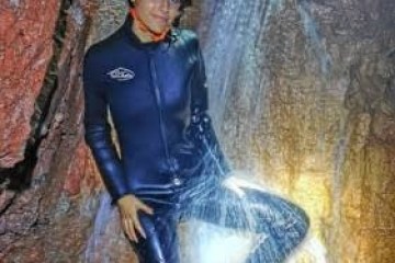 a man riding on top of a rock