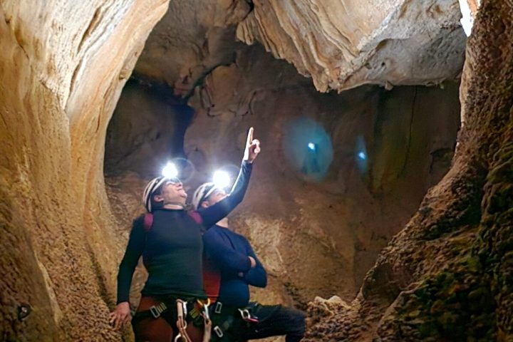 a person riding on top of a rock
