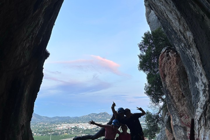 a man standing on a rocky hill