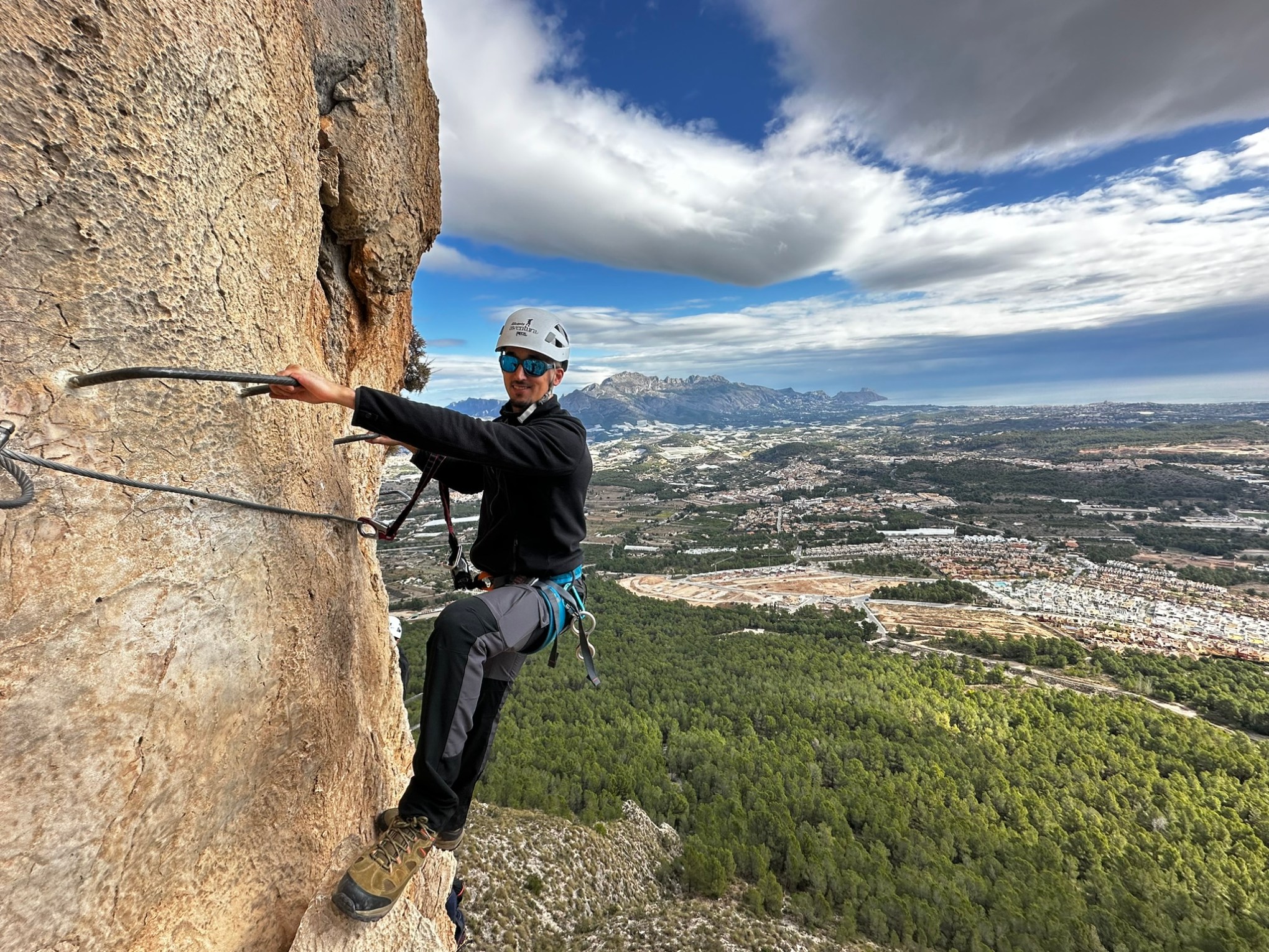 a man standing on a rocky hill