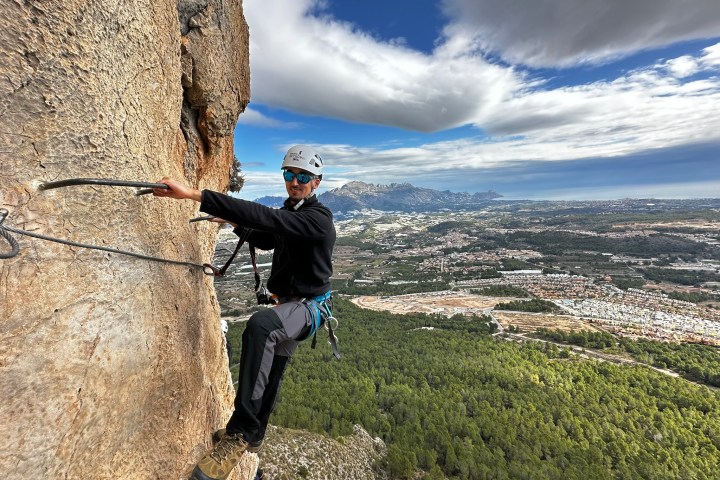 a man standing on a rocky hill