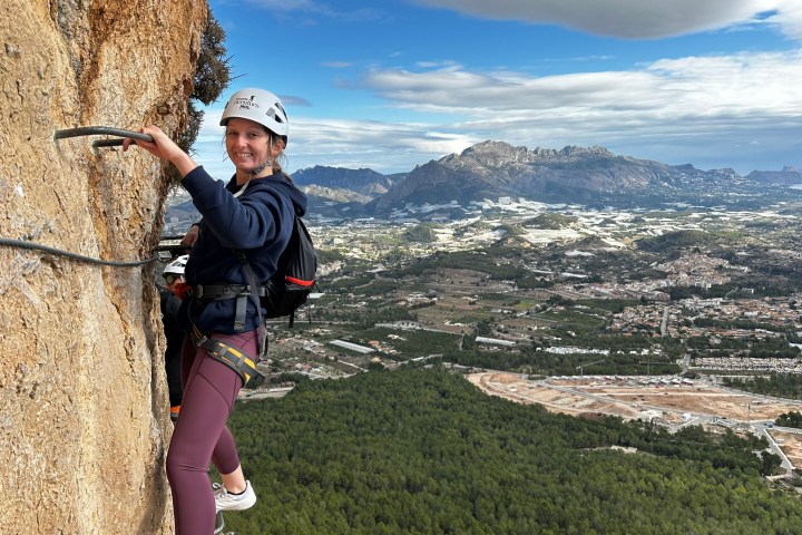 a person standing in front of a mountain