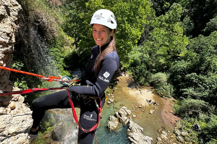 Lara Gut standing on a rock