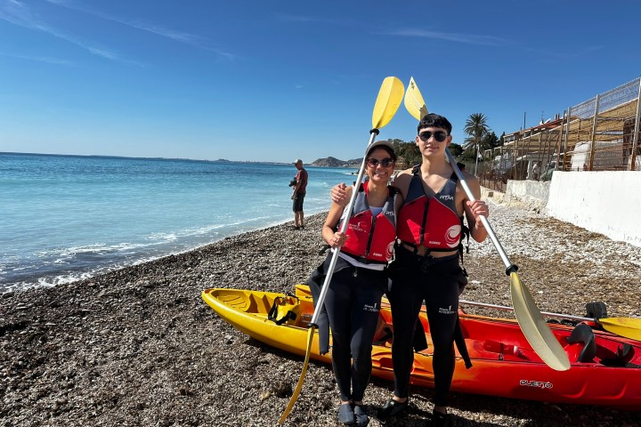 a group of people on a boat in the water