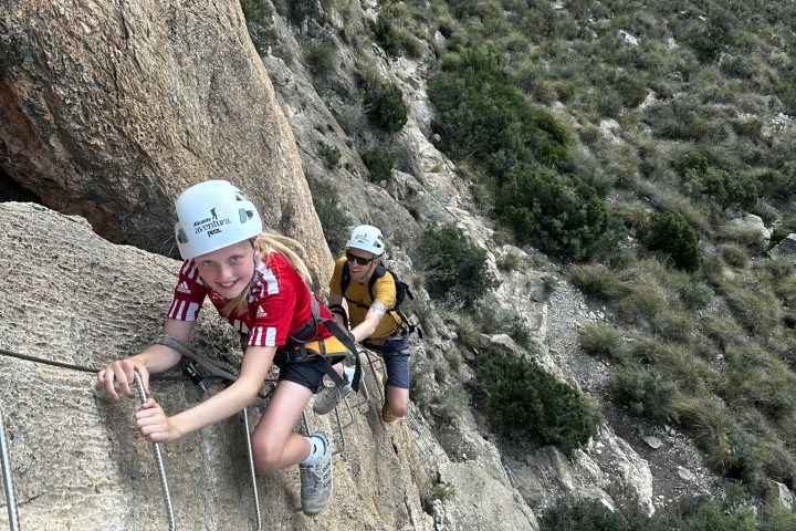 a man riding on top of a rock