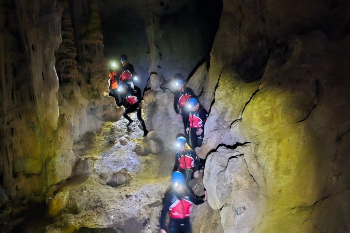 a man riding a bike down a dirt road