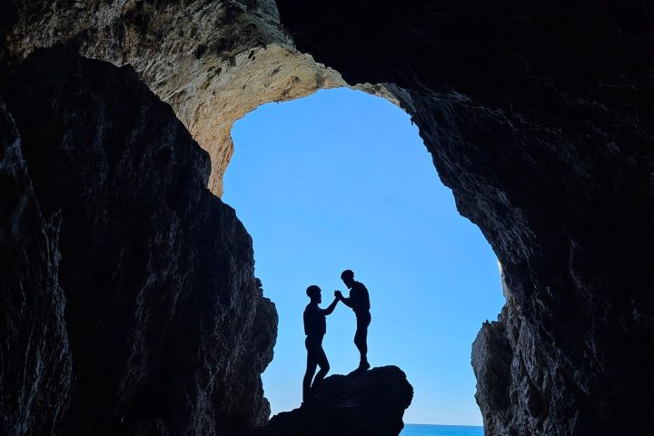 a person that is standing in the dark