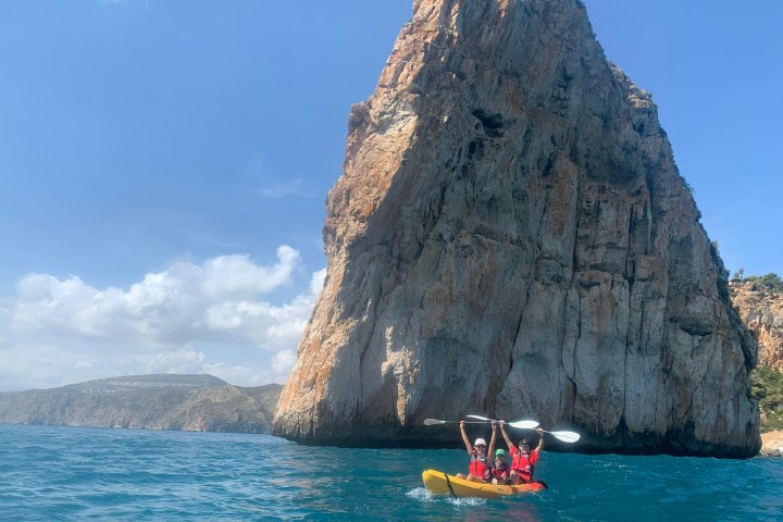 a large body of water with a mountain in the background