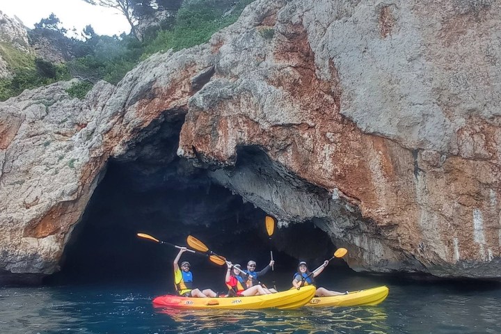 a person riding on the back of a boat in the water