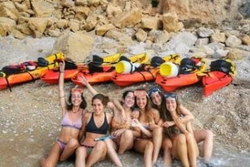 a group of people swimming in the water