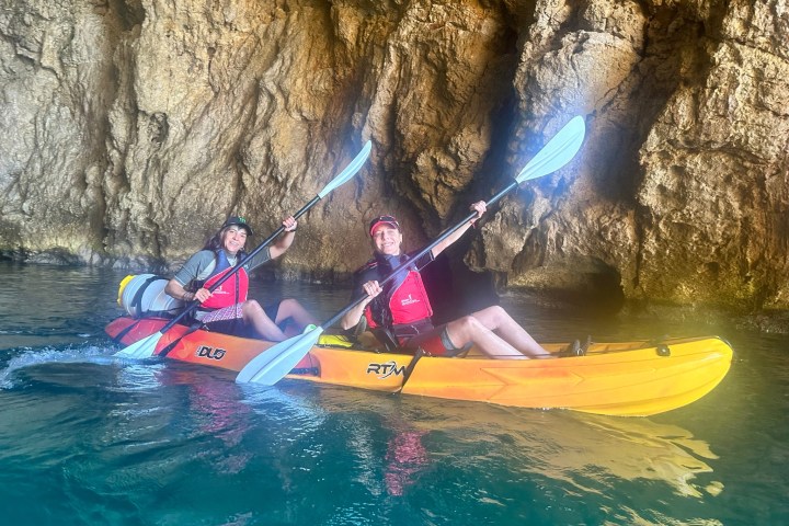 a little girl riding on a raft in the water