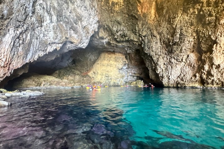 a large rock in a pool of water