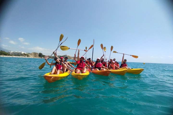 a group of people on a boat in the water
