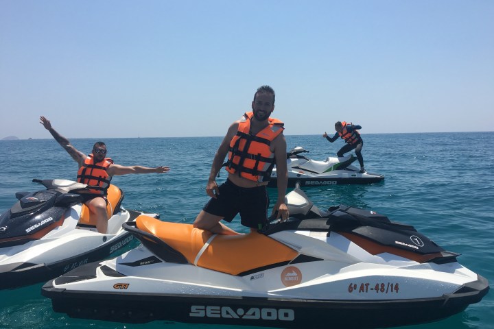 a group of people on a boat in the water