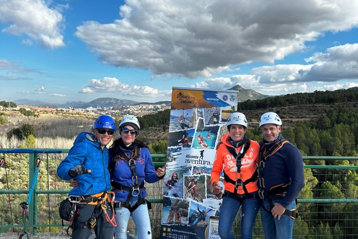 a group of people standing on top of a hill