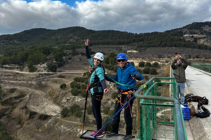 a group of people standing on top of a mountain