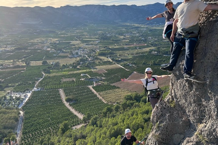 a group of people standing on top of a mountain