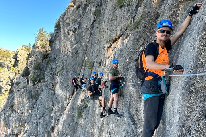 a group of people riding skis on top of a mountain